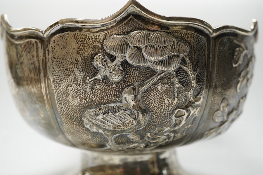 A late 19th/early 20th century Chinese white metal pedestal bowl, decorated with birds and foliage, diameter 15.2cm, 9.5oz. Condition - fair to good.